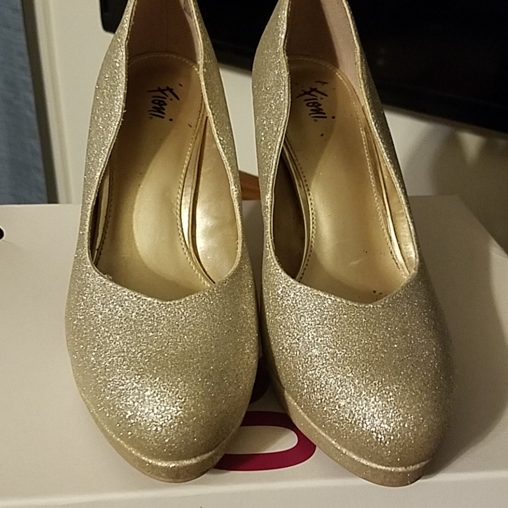 Gold high heals. Lightly worn.